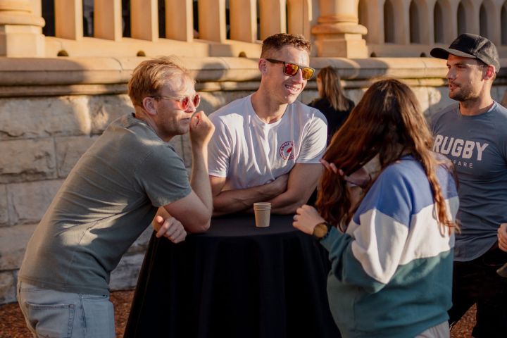 a group of people standing in front of a building