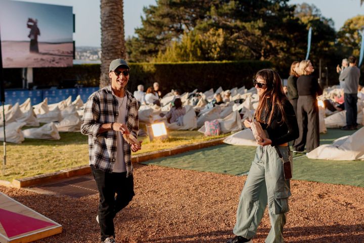 a group of baseball players standing on top of a field