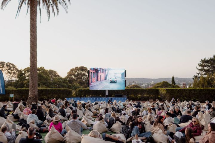a group of people standing in front of a crowd
