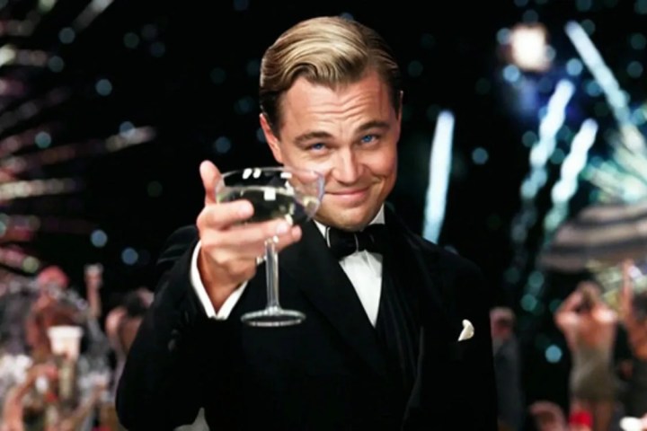Leonardo DiCaprio wearing a suit and tie talking on a cell phone